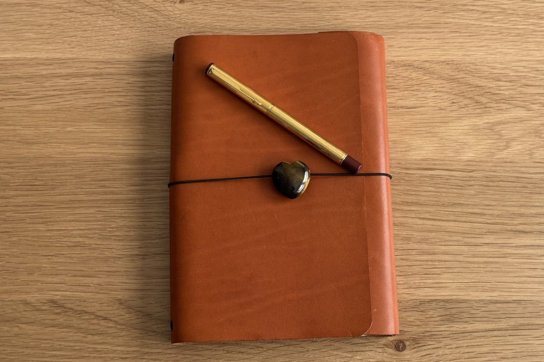 Floramoon handmade leather notebook cover with vintage Parker 88 fountain pen on wood surface