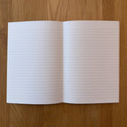 Apica CD Notebook A5 open to show the lined interior pages