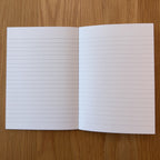 Apica CD Notebook A6 open to show the lined interior pages