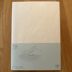Midori MD Notebook A5 with glassine paper cover printed with a Grid ruling label and illustration