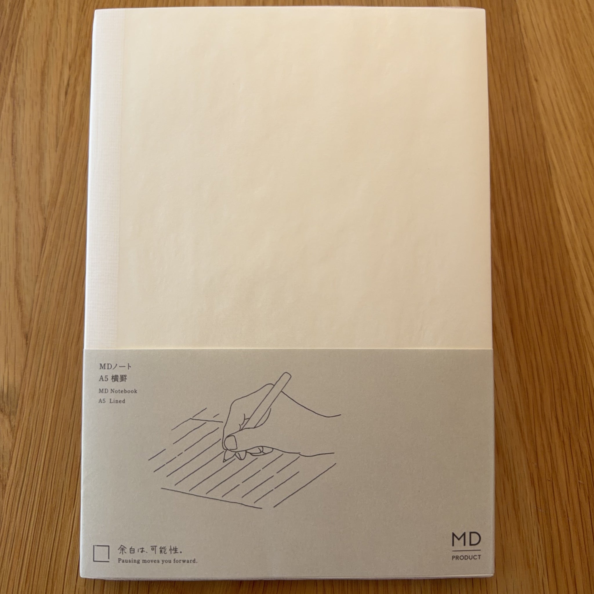 Midori MD Notebook A5 with glassine paper cover printed with a Lined ruling label and illustration