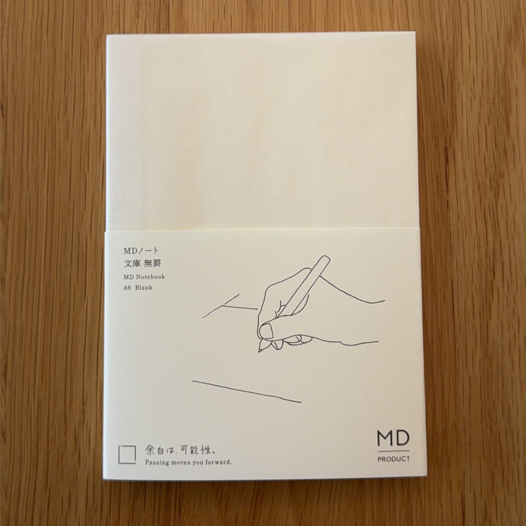 Midori MD Notebook A6 with glassine paper cover printed with a Blank ruling label and illustration